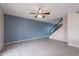 Open living room showcases tile flooring, a ceiling fan, and a staircase to the second floor at 3823 N 28Th St, Phoenix, AZ 85016