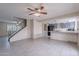 Open-concept living room showcases tile floors and easy access to the kitchen and stairs at 3823 N 28Th St, Phoenix, AZ 85016