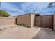 Back patio features brick walls and a secure, wood gate at 3823 N 28Th St, Phoenix, AZ 85016