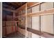 Unfinished storage room with wood shelving at 3823 N 28Th St, Phoenix, AZ 85016