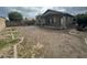 Spacious backyard, featuring a patio, and bordered by brick edging and block wall at 4050 E Agave Rd, Phoenix, AZ 85044