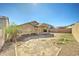 A large backyard with potential for landscaping with a covered patio and block fence at 4050 E Agave Rd, Phoenix, AZ 85044