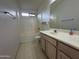 Bright bathroom featuring a single sink vanity and a shower-tub combo at 4050 E Agave Rd, Phoenix, AZ 85044