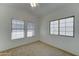 Bedroom featuring two large windows at 4050 E Agave Rd, Phoenix, AZ 85044