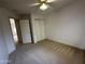 This bedroom includes carpet and a closet with sliding doors at 4050 E Agave Rd, Phoenix, AZ 85044