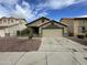 Charming single Gathering home featuring desert landscaping, two-car garage, and neutral earth-tone color scheme at 4050 E Agave Rd, Phoenix, AZ 85044