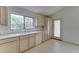 Bright eat-in kitchen features white appliances and light cabinets at 4050 E Agave Rd, Phoenix, AZ 85044