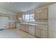 Bright eat-in kitchen features white appliances and light cabinets at 4050 E Agave Rd, Phoenix, AZ 85044