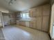 Spacious kitchen with tiled floors, bright countertops, and ample cabinetry at 4050 E Agave Rd, Phoenix, AZ 85044