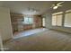 Open-concept kitchen and dining area featuring a combination of carpet and tile flooring at 4050 E Agave Rd, Phoenix, AZ 85044