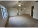 Bright and airy living room with neutral carpet and ceiling fan at 4050 E Agave Rd, Phoenix, AZ 85044