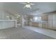 Open living room view to kitchen area with neutral colored cabinets at 4050 E Agave Rd, Phoenix, AZ 85044