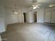 Spacious living room featuring neutral carpet and ceiling fan at 4050 E Agave Rd, Phoenix, AZ 85044