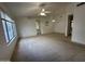 Bright and airy living room with neutral carpet and ceiling fan at 4050 E Agave Rd, Phoenix, AZ 85044