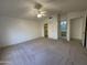 The main bedroom includes carpet, a walk-in closet and an ensuite bathroom at 4050 E Agave Rd, Phoenix, AZ 85044