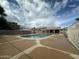 Community pool featuring lounge chairs and a clean swimming area on a cloudy day at 4050 E Agave Rd, Phoenix, AZ 85044