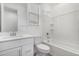 Bright bathroom featuring a tub with tile surround, white vanity, and modern fixtures at 4135 E Sagebrush St, Gilbert, AZ 85296