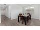 Bright dining room with a dark wood table and tile flooring at 4135 E Sagebrush St, Gilbert, AZ 85296