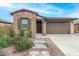 Charming single-story home with stone accents, a two-car garage, and a neatly landscaped front yard at 4135 E Sagebrush St, Gilbert, AZ 85296