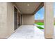 View of the covered patio, with tile flooring, neutral tones, and opening to the backyard at 4135 E Sagebrush St, Gilbert, AZ 85296