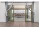 View of a beautifully paved patio and green turf from inside the home through sliding glass doors at 4135 E Sagebrush St, Gilbert, AZ 85296