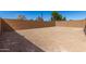 Vacant backyard area enclosed by block wall providing space for outdoor activities and landscaping at 5352 W Las Palmaritas Dr, Glendale, AZ 85302
