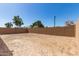 Expansive backyard featuring a sturdy brick wall, offering privacy and potential for landscaping at 5352 W Las Palmaritas Dr, Glendale, AZ 85302