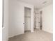 This bedroom has neutral carpet and closet access at 5352 W Las Palmaritas Dr, Glendale, AZ 85302