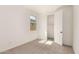 A bedroom with neutral carpet and closet access at 5352 W Las Palmaritas Dr, Glendale, AZ 85302