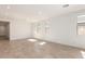 Bright living room with tile floors and large windows offering plenty of natural light at 5352 W Las Palmaritas Dr, Glendale, AZ 85302