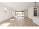 Large living room with an open floor plan, tile flooring, and lots of natural light at 5352 W Las Palmaritas Dr, Glendale, AZ 85302