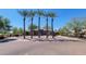 Clubhouse surrounded by palm trees with ample parking, and a well-maintained landscape at 5401 E Van Buren St # 2095, Phoenix, AZ 85008