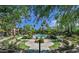 Beautiful community pool area surrounded by lush landscaping and palm trees at 5401 E Van Buren St # 2095, Phoenix, AZ 85008