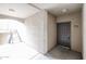 Hallway leading to a door with unit number 2095 and stairs with natural light at 5401 E Van Buren St # 2095, Phoenix, AZ 85008