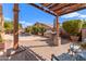 Backyard featuring outdoor kitchen, pergola, and pool at 5929 W Riviera Dr, Glendale, AZ 85304