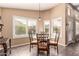 Bright dining area with plantation shutters and glass top table at 5929 W Riviera Dr, Glendale, AZ 85304