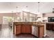 Open concept kitchen area with stainless steel appliances at 5929 W Riviera Dr, Glendale, AZ 85304