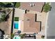 An aerial view of the property featuring a private backyard pool with a small lawn at 6759 E Aire Libre Ln, Scottsdale, AZ 85254