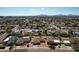 Aerial view of a community with well-maintained homes featuring green spaces and swimming pools at 6759 E Aire Libre Ln, Scottsdale, AZ 85254