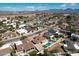 An aerial view of a residential neighborhood featuring homes with pools and desert landscaping at 6759 E Aire Libre Ln, Scottsdale, AZ 85254