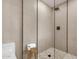 Modern bathroom featuring sleek glass shower, neutral tile, and hexagon tile flooring at 6759 E Aire Libre Ln, Scottsdale, AZ 85254