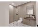 Modern bathroom with stylish wood vanity, sleek fixtures, and glass-enclosed shower at 6759 E Aire Libre Ln, Scottsdale, AZ 85254