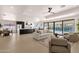 Open-concept living room featuring modern furnishings and sliding glass doors to the pool at 6759 E Aire Libre Ln, Scottsdale, AZ 85254