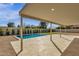 Expansive covered patio next to sparkling pool offers ample space for relaxing and entertaining at 6759 E Aire Libre Ln, Scottsdale, AZ 85254