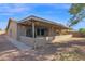 Home exterior featuring a covered patio with a concrete block barrier at 6824 N 31 Ave, Phoenix, AZ 85017