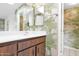 Bathroom featuring a vanity with a sink and patterned wallpaper at 6824 N 31 Ave, Phoenix, AZ 85017