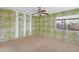 Bright bedroom featuring tropical themed wallpaper and a ceiling fan at 6824 N 31 Ave, Phoenix, AZ 85017