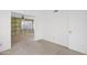 Bright bedroom with patterned wallpaper, neutral carpet, and a window at 6824 N 31 Ave, Phoenix, AZ 85017