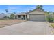 Single-story home with a two-car garage and a long driveway at 6824 N 31 Ave, Phoenix, AZ 85017