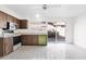 Bright kitchen featuring a vintage green dishwasher, tile floors and a sliding glass door to the yard at 6824 N 31 Ave, Phoenix, AZ 85017